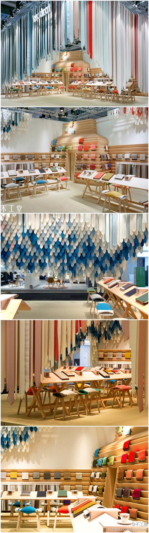 层叠的面料缎带构成了展台的背景,既独特又呼应了品牌的产品本质